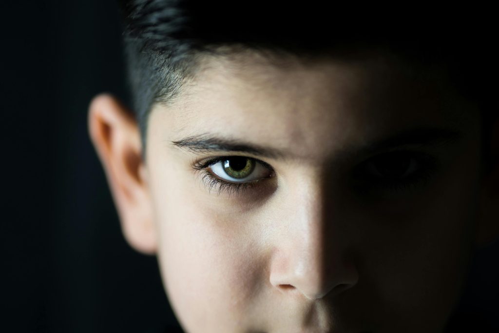 A boy with unique green eyes